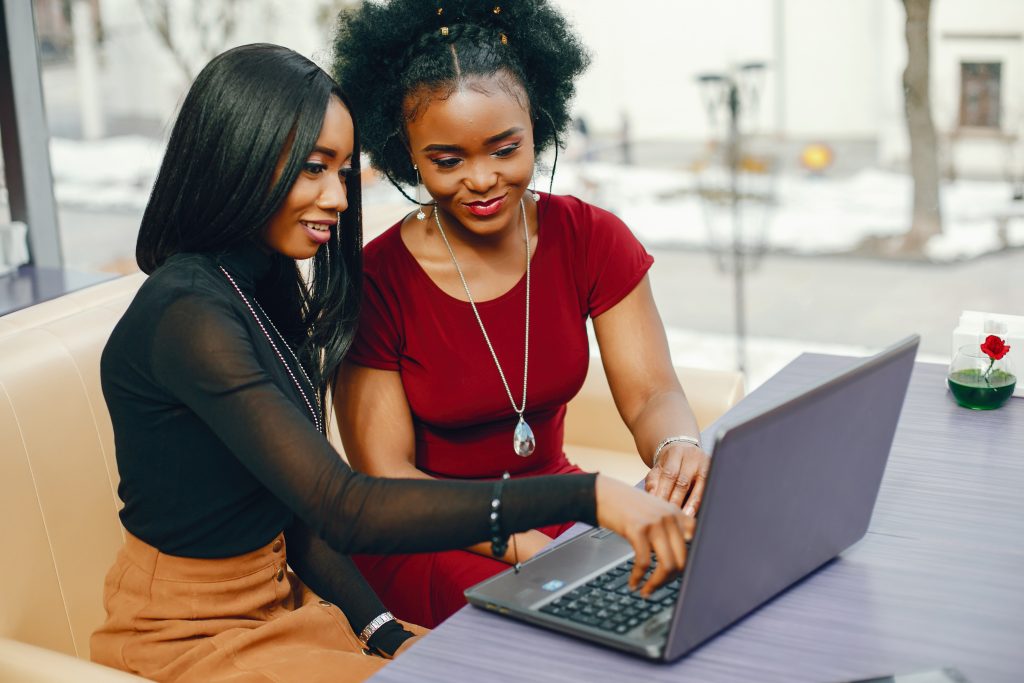 two business women, on a laptop searching for solutions to help their failing business photo credit Freepik.com
